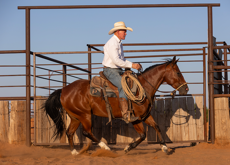 Buster McLaury on a horse at the Pitchfork Ranch