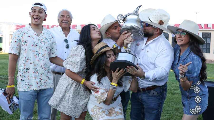 Olivarez family kissing the trophy after winning the All American Futurity. Photo by Coady Media (623) 203-4084