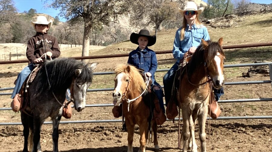 The Young kids horseback before their first trip to the ocean