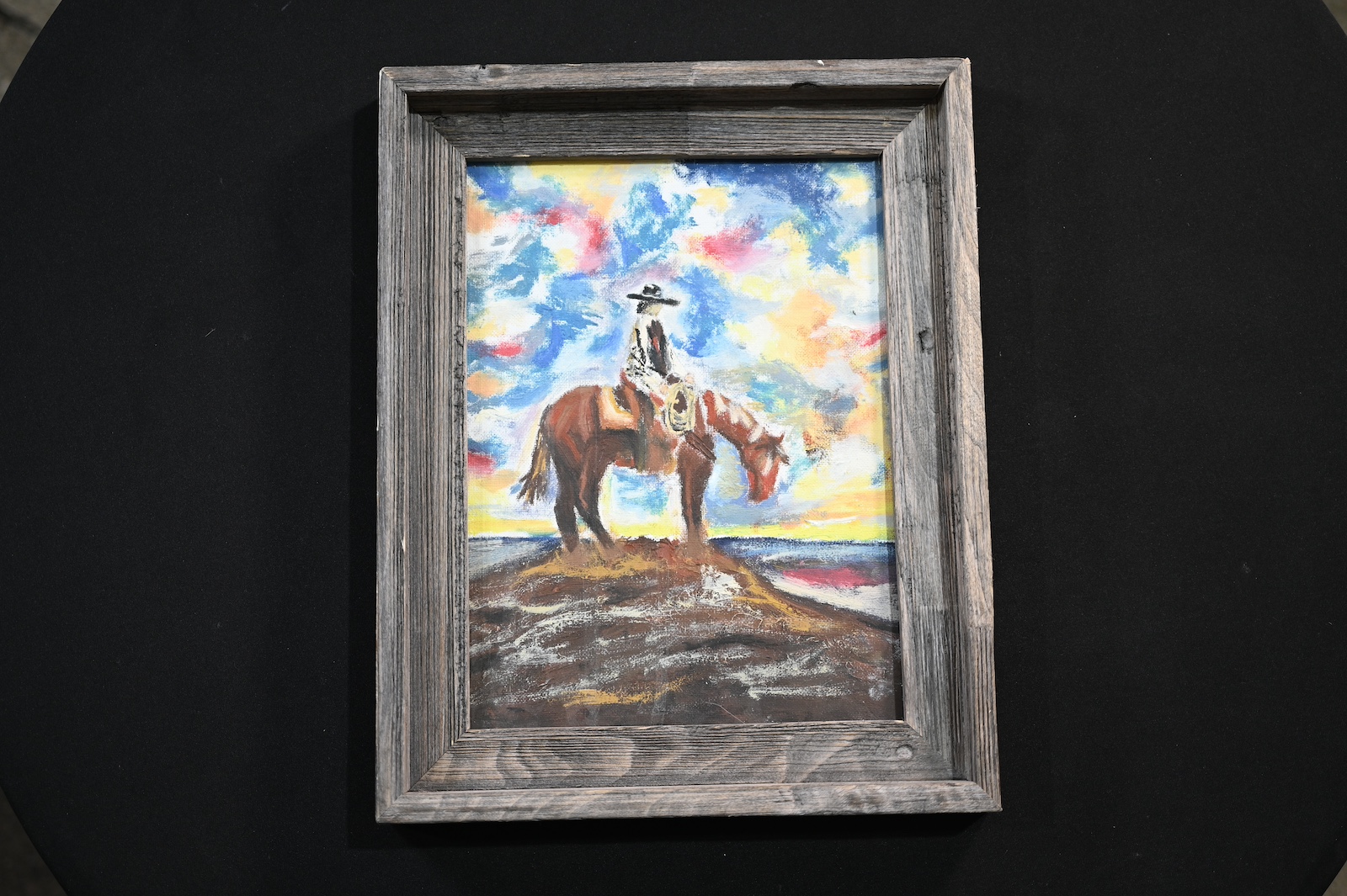Belle Brackett's oil painting of a cowboy