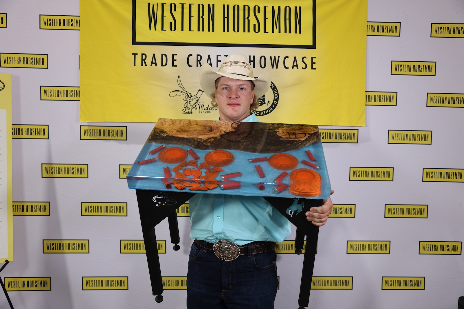 Isaac Frandsen with his trap shooting epoxy-welded table