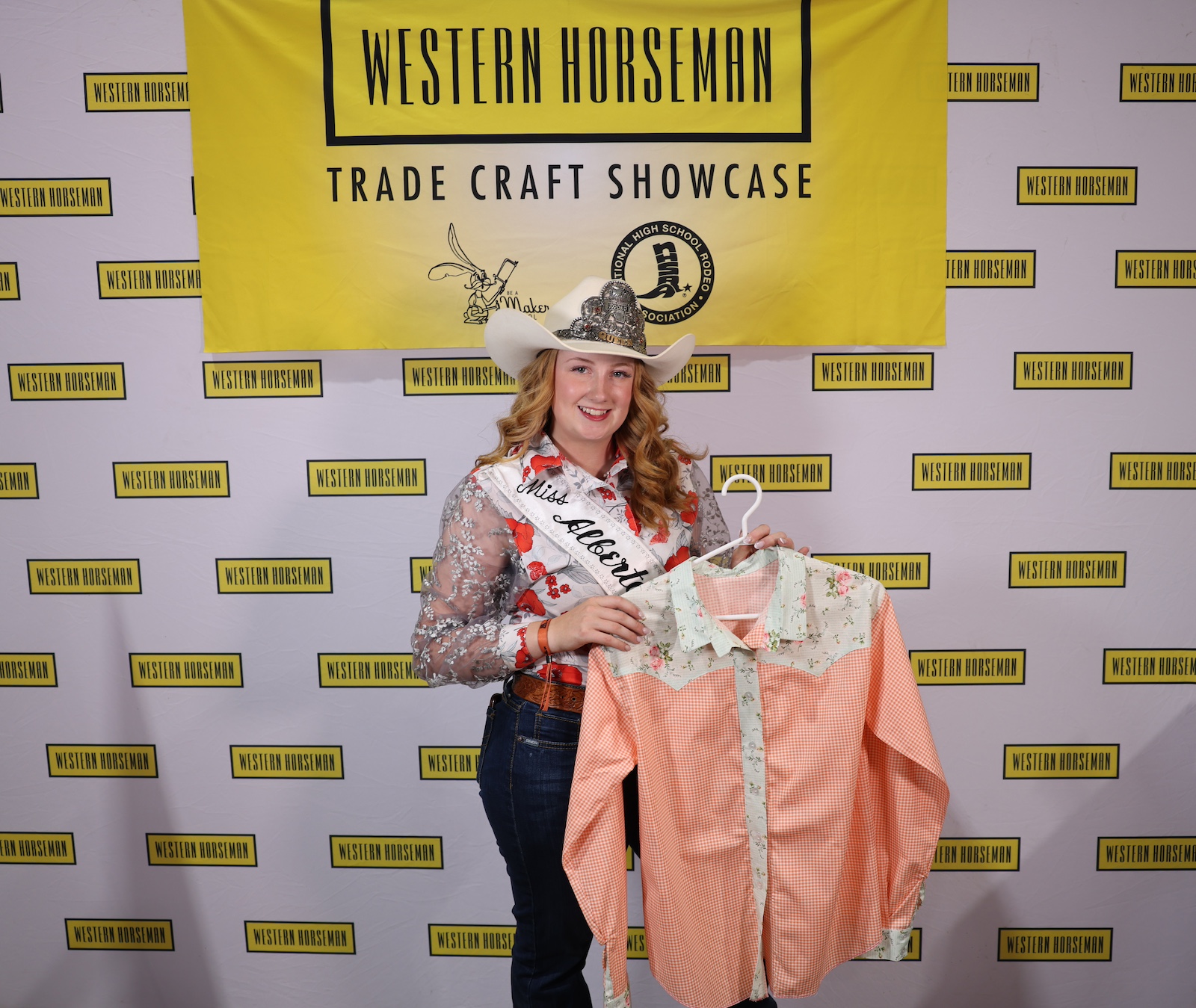 Kally Wills with her orange checkered and flowered button-up shirt