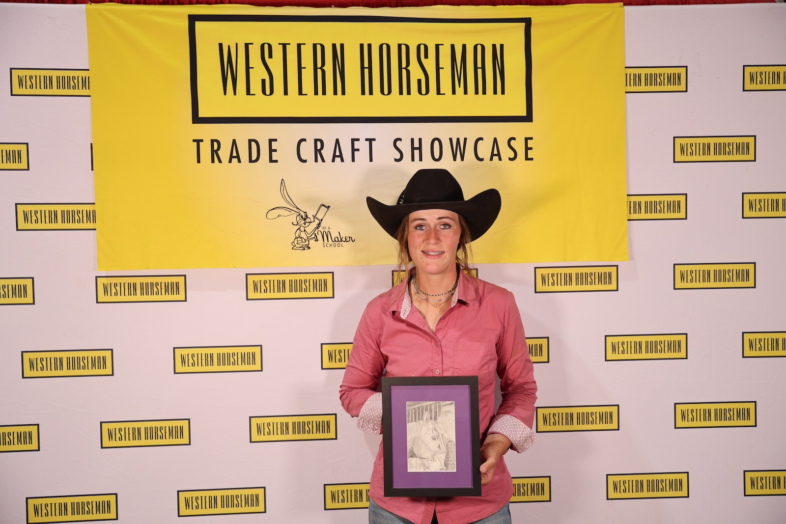 Tava Sexton with her pencil drawing of herself and her horse