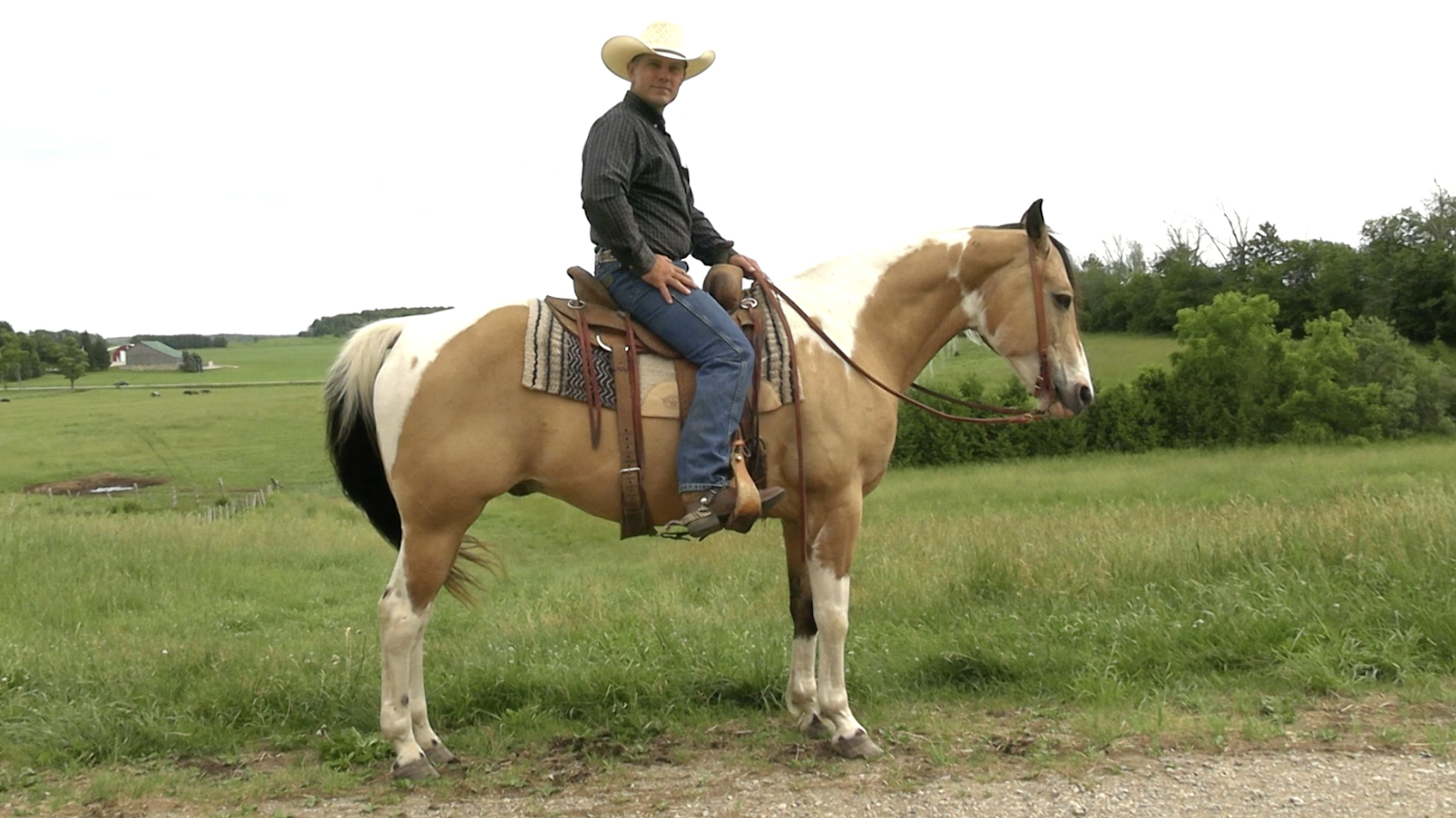 Jason Irwin horseback explaining how to open & close gates that swing toward you