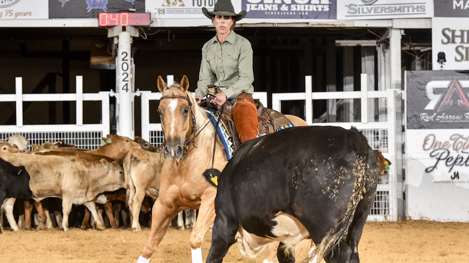 Kelli Neubert in a cutting competition