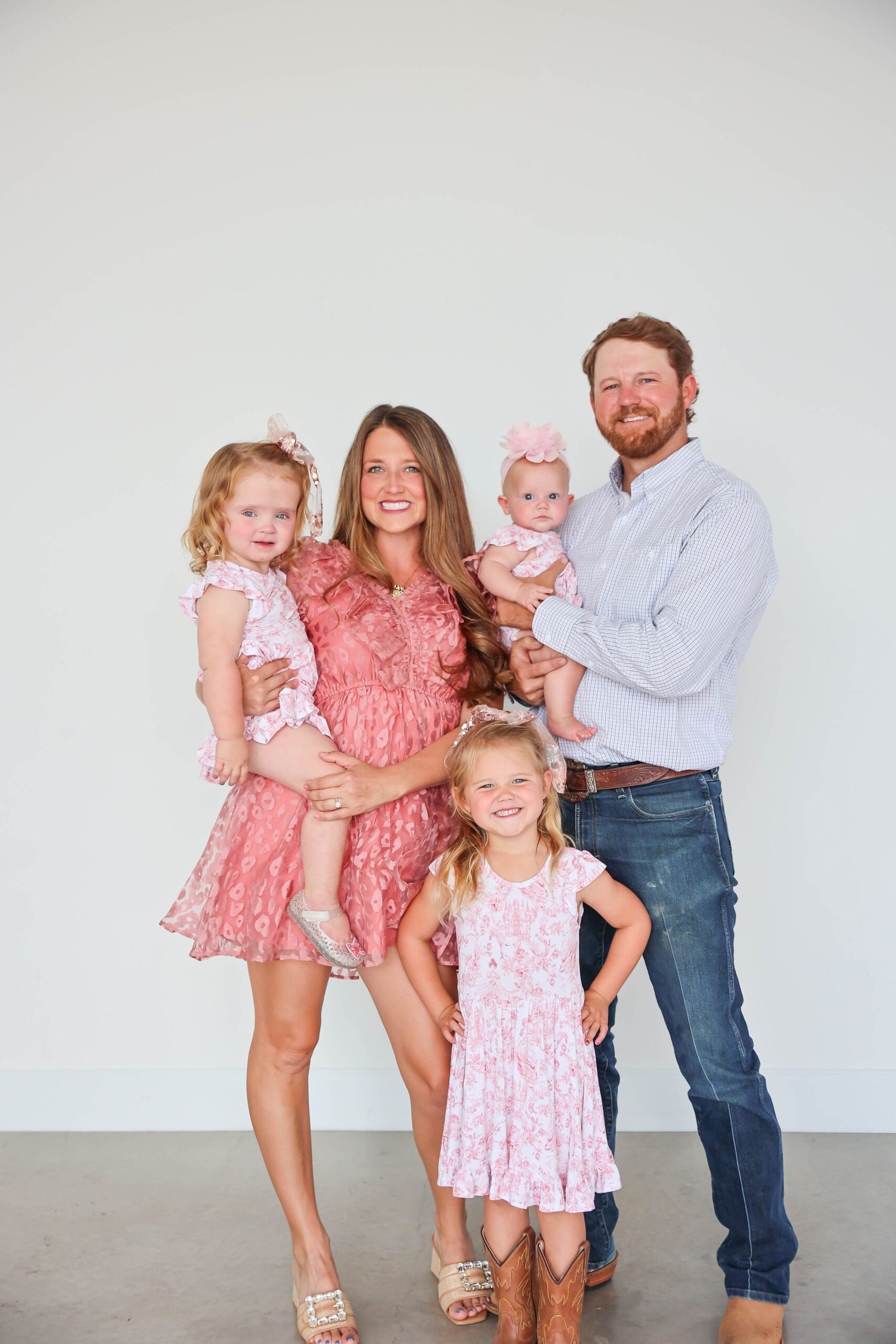 Tucker and his wife, Karley, with their daughters, Rayley, Brooklyn and Lyla.