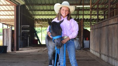 Mae Neubert with her pony Donut